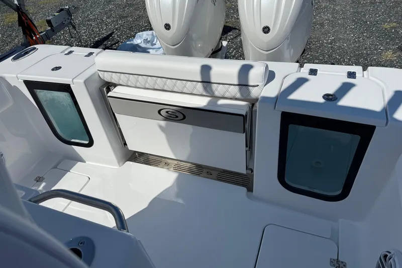 Slide: The Image of 2026 Sportsman Open 262 Center Console boat interior with dual engines and seating area. - 6