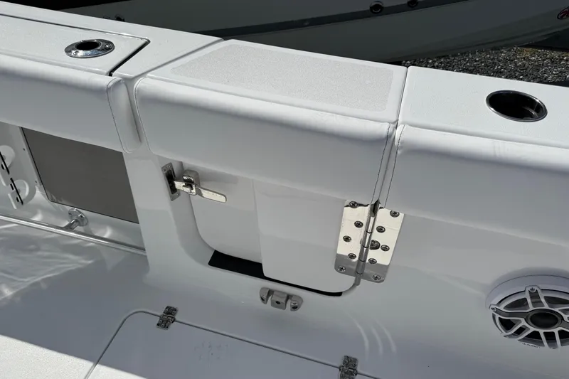 Slide: The Image of 2026 Sportsman Open 262 Center Console boat interior, featuring sleek white seating and stainless steel hardware. - 8