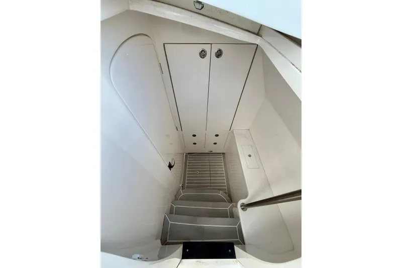 Slide: The Image of Interior cabin of 2022 Intrepid 407 Nomad SE boat, featuring steps and storage. - 22