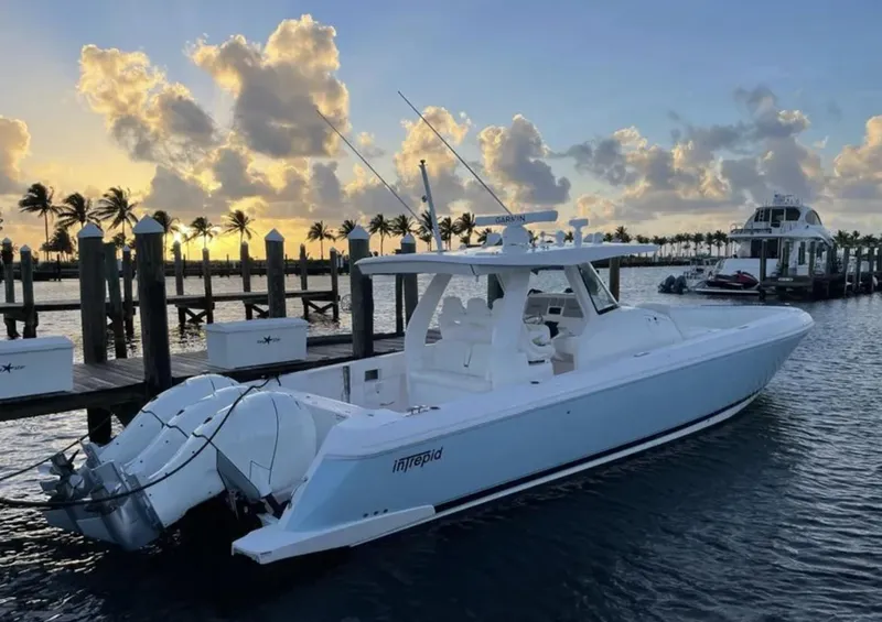 Slide: The Image of Intrepid 407 Nomad SE 2022 boat docked at sunset. - 32