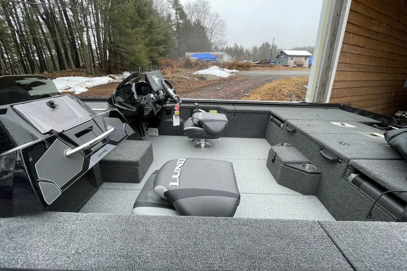 Slide: The Image of 2026 Lund 2075 Pro-V Bass XS boat interior with seating and control panel. - 10