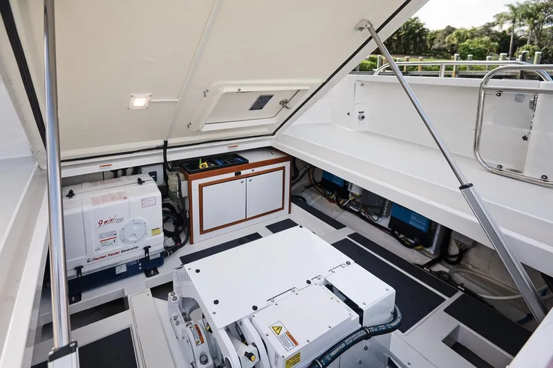 Slide: The Image of Engine compartment of 2023 Back Cove 39O boat, featuring generator and storage. - 45