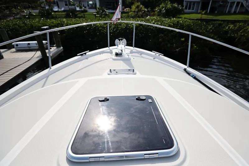 Slide: The Image of Bow view of 2023 Back Cove 39O boat, featuring sleek deck design and hatch. - 47