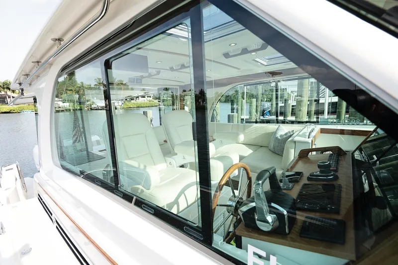 Slide: The Image of 2023 Back Cove 39O yacht interior with luxurious seating and modern controls. - 50