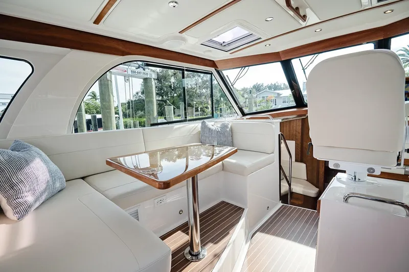Slide: The Image of Luxurious interior of 2023 Back Cove 39O yacht with elegant seating and table. - 8