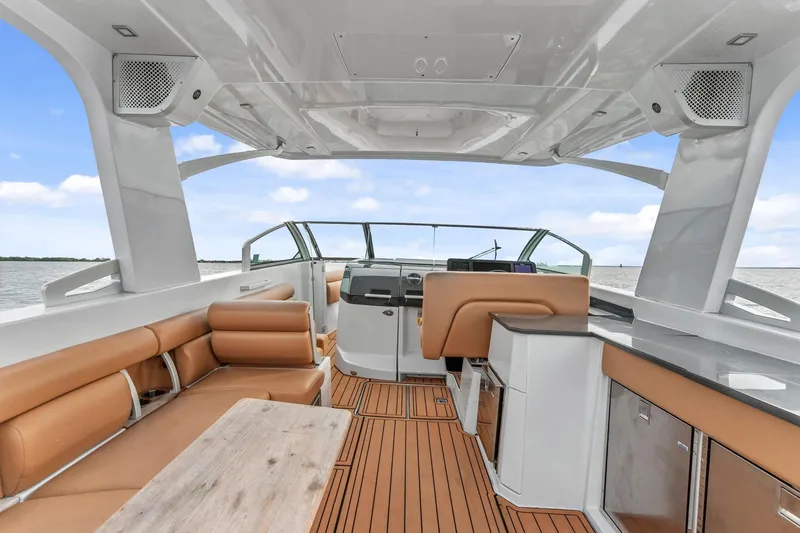 Slide: The Image of 2021 Aviara AV36 OB boat interior with tan seating and modern helm. - 15