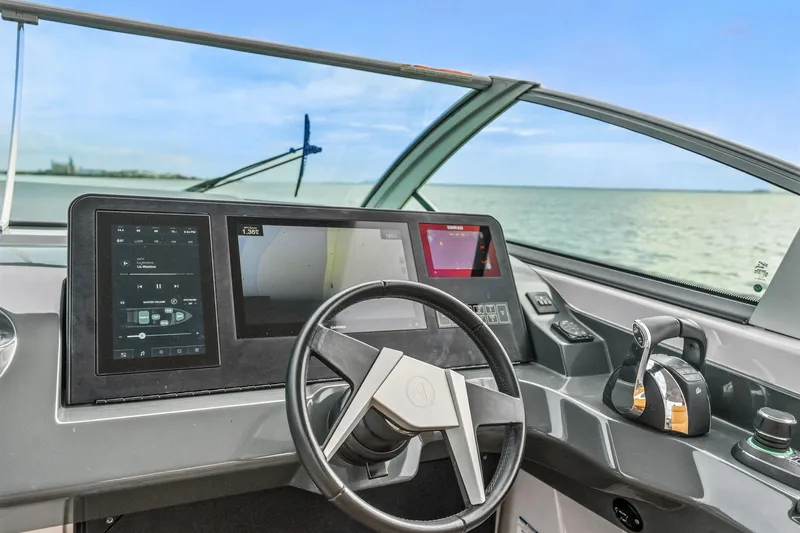 Slide: The Image of Cockpit of 2021 Aviara AV36 OB boat with modern controls and steering wheel. - 31