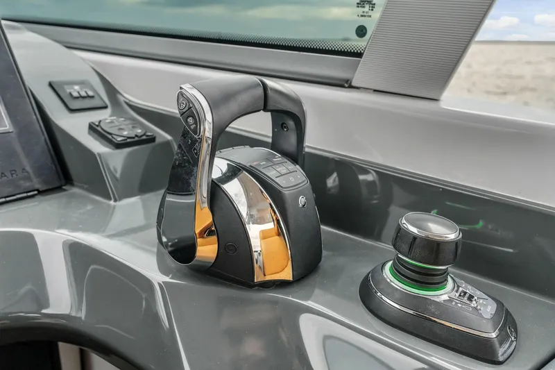 Slide: The Image of 2021 Aviara AV36 OB boat control panel with throttle and joystick. - 32