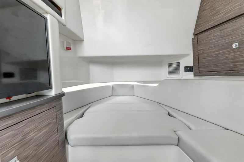 Slide: The Image of Interior of 2021 Aviara AV36 OB boat with modern seating and cabinetry. - 37