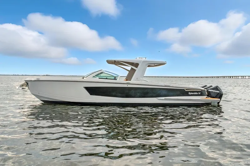 Slide: The Image of 2021 Aviara AV36 OB boat on calm water under a blue sky. - 4
