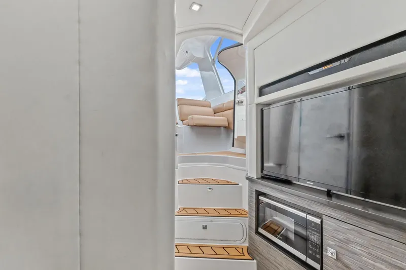 Slide: The Image of Interior view of 2021 Aviara AV36 OB yacht with stairs, TV, and microwave. - 40