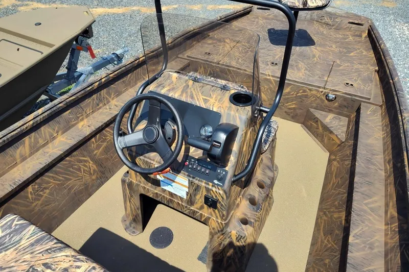 Slide: The Image of 2025 G3 Gator Tough 18 CC boat with camo design and steering console. - 5
