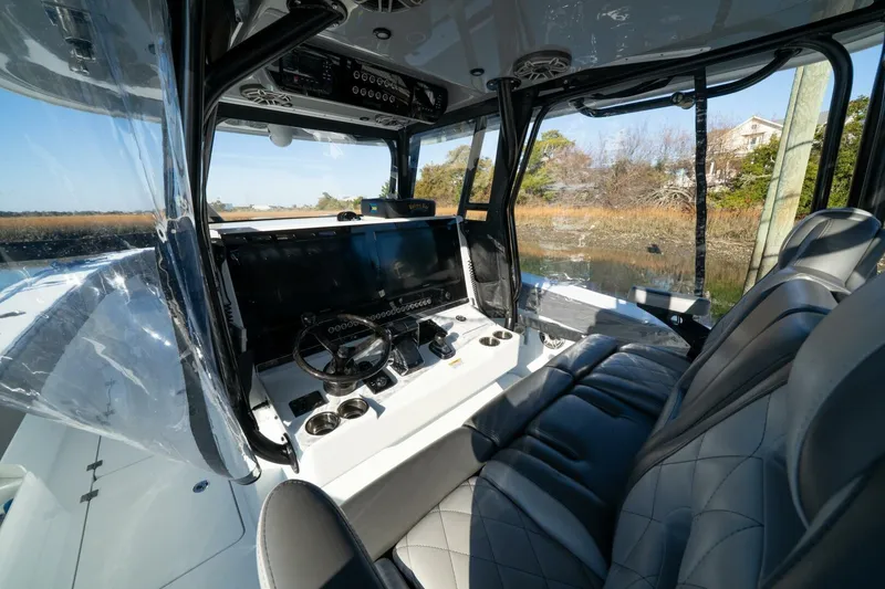 Slide: The Image of Interior of 2024 Freeman 38 boat with modern steering and seating. - 29