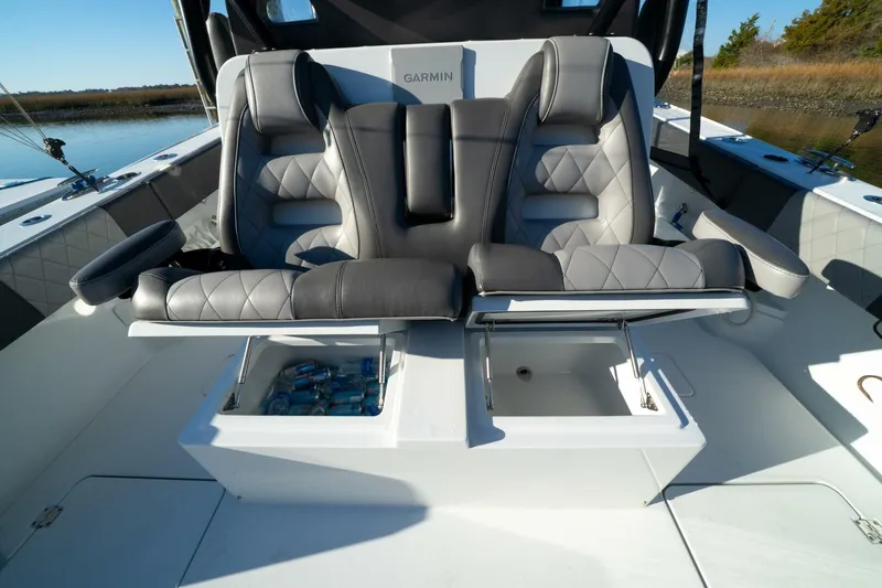 Slide: The Image of 2024 Freeman 38 boat interior with luxury seating and storage compartments. - 33