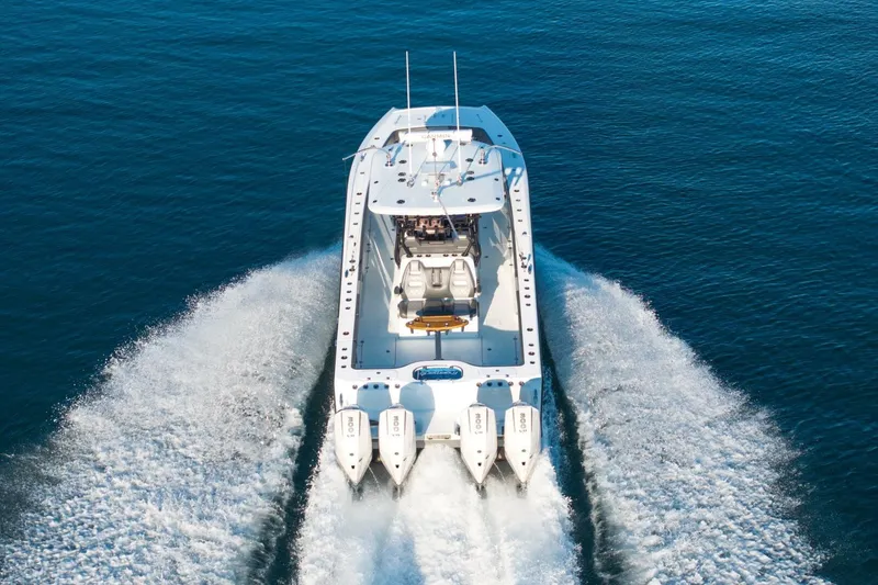 Slide: The Image of 2024 Freeman 38 boat cruising on open water with four powerful engines. - 4