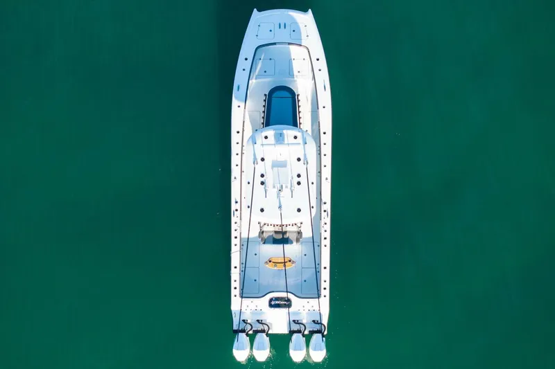 Slide: The Image of Aerial view of 2024 Freeman 38 boat on clear green water. - 45