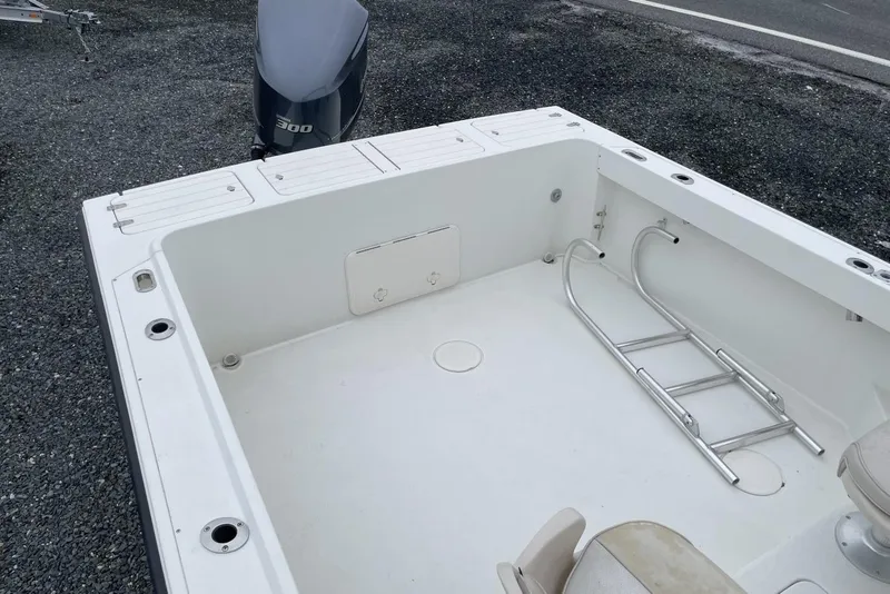 Slide: The Image of 2014 Parker 2310 DV Walkaround boat deck with ladder and engine. - 10