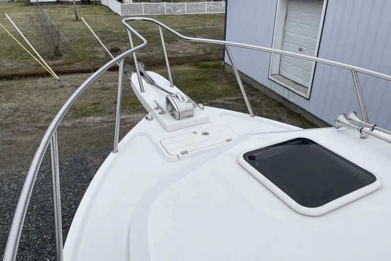 Slide: The Image of 2014 Parker 2310 DV Walkaround boat deck with railing and hatch. - 11