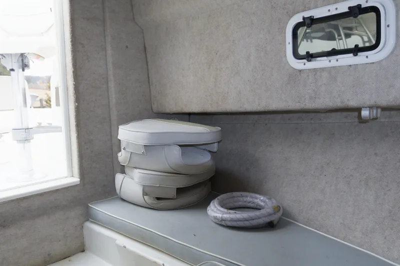 Slide: The Image of Interior of 2014 Parker 2310 DV Walkaround boat with seat and rope. - 18