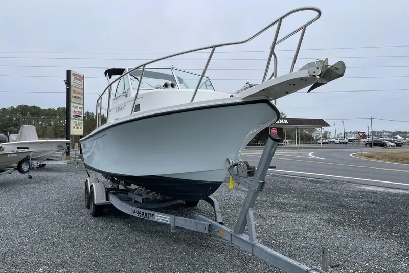 Slide: The Image of 2014 Parker 2310 DV Walkaround boat on trailer in parking lot. - 4