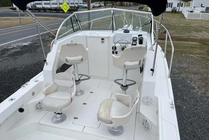 Slide: The Image of 2014 Parker 2310 DV Walkaround boat with white seating and steering console. - 5