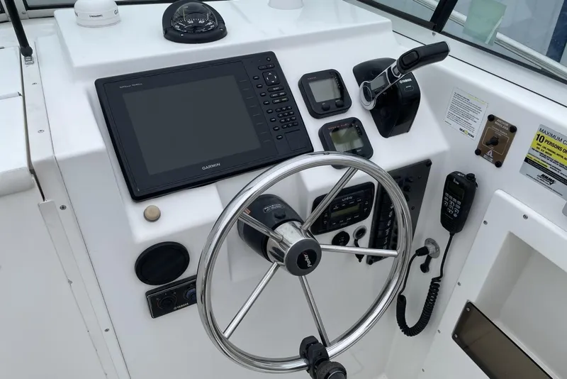 Slide: The Image of Control panel of 2014 Parker 2310 DV Walkaround boat with Garmin navigation system. - 9