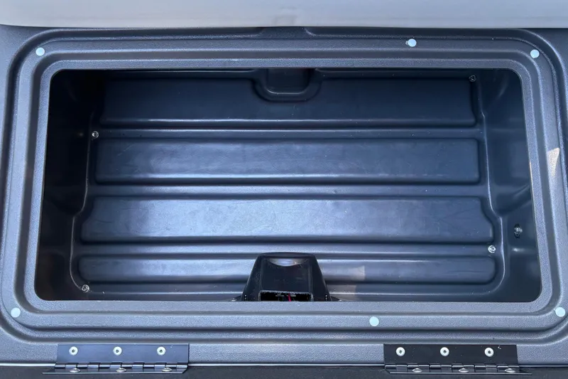 Slide: The Image of Storage compartment of 2026 Sun Tracker Fishin' Barge 20 DLX, featuring durable construction. - 31