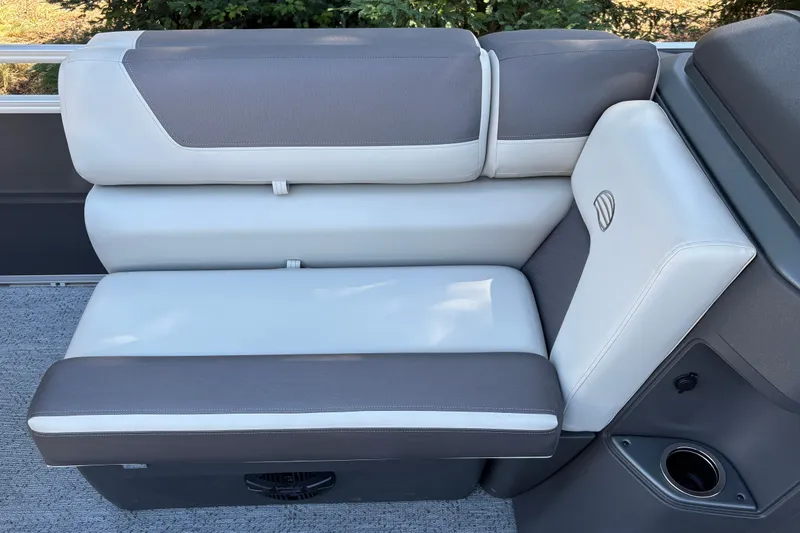 Slide: The Image of 2026 Sun Tracker Fishin' Barge 20 DLX seating with gray and white upholstery. - 15
