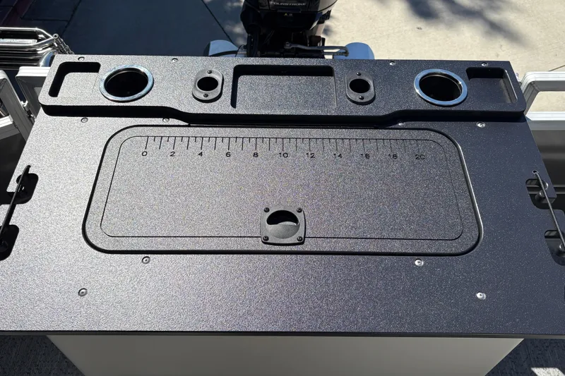 Slide: The Image of Control panel of 2026 Sun Tracker Fishin' Barge 20 DLX with measurement markings. - 25