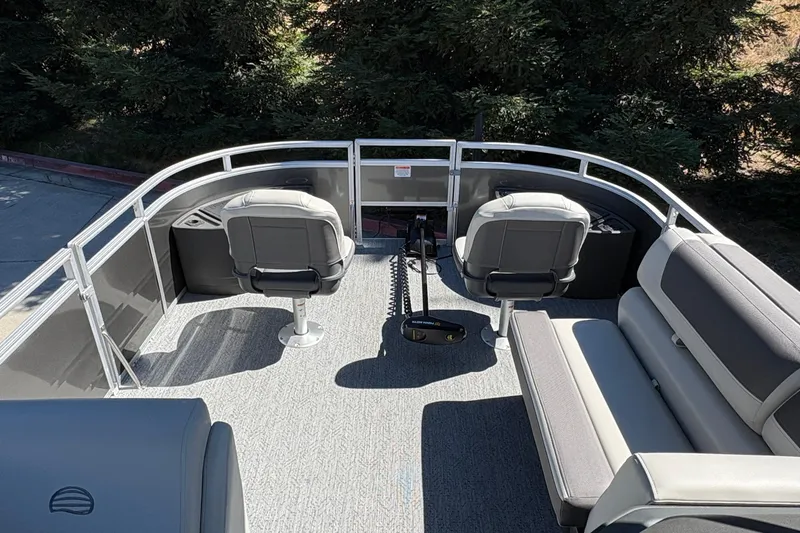 Slide: The Image of 2026 Sun Tracker Fishin' Barge 20 DLX interior with seating and fishing setup. - 16
