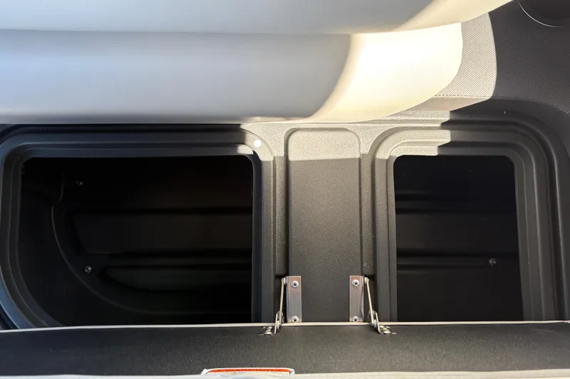 Slide: The Image of Storage compartments on a 2026 Sun Tracker Fishin' Barge 20 DLX boat. - 35