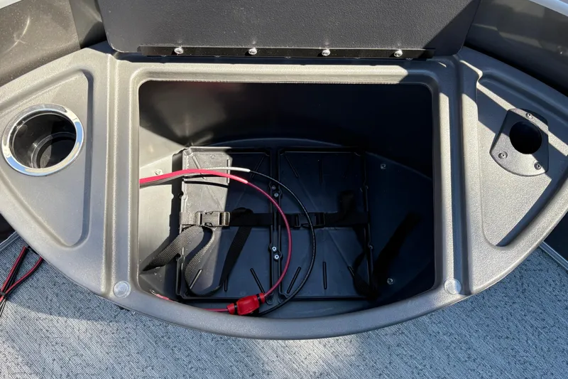 Slide: The Image of Battery compartment of 2026 Sun Tracker Fishin' Barge 20 DLX with cup holder. - 22