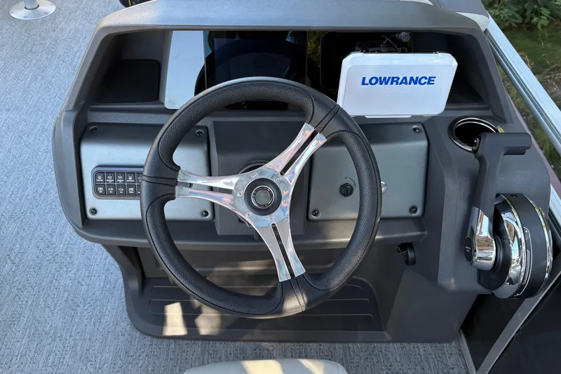 Slide: The Image of Steering console of 2026 Sun Tracker Fishin' Barge 20 DLX with Lowrance electronics. - 17