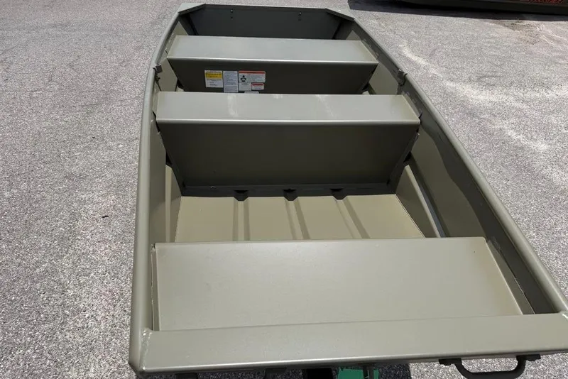 Slide: The Image of 2026 Tracker Grizzly 10 Jon boat, interior view, showing seating and storage. - 32