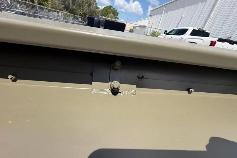 Slide: The Image of Close-up of 2026 Tracker Grizzly 10 Jon boat's metal joint and bolts. - 30