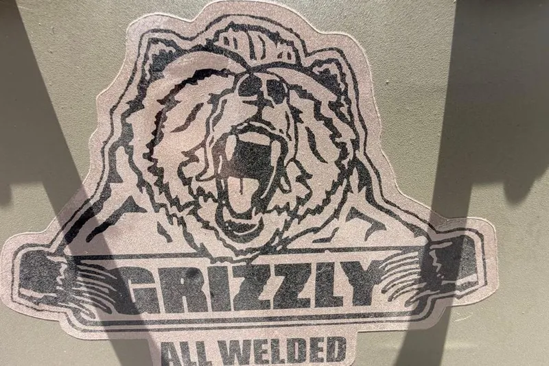 The Image of Sticker of roaring bear with "Grizzly All Welded" text on Tracker Grizzly 10 Jon 2026. - 0