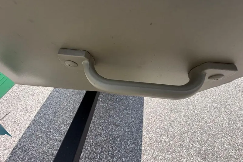 Slide: The Image of Handle of 2026 Tracker Grizzly 10 Jon boat on pavement background. - 29