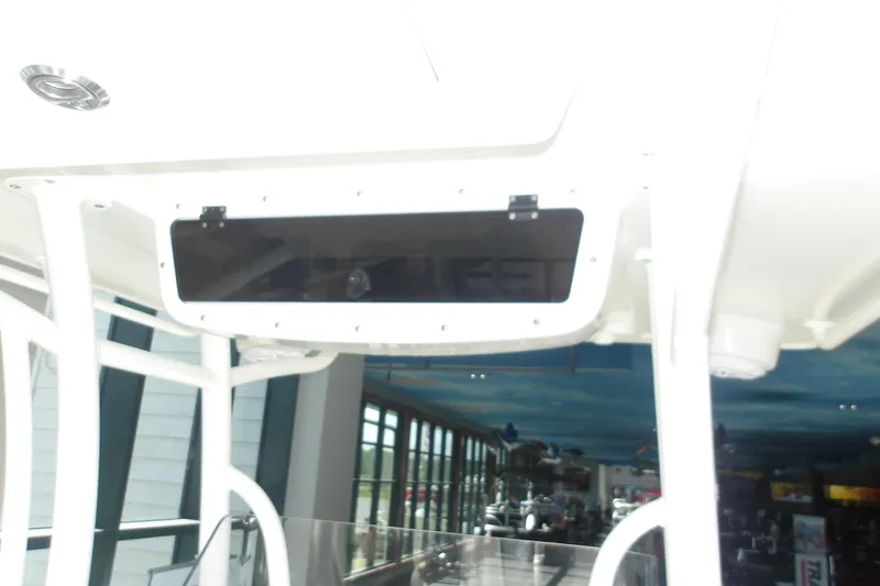 Slide: The Image of Overhead console on 2026 Ranger 2360 Bay boat, featuring sleek design and modern fixtures. - 17