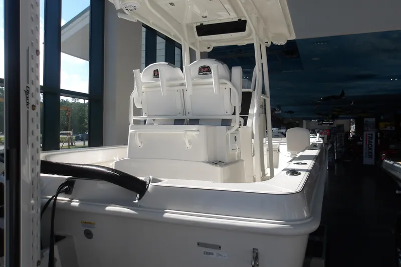 Slide: The Image of 2026 Ranger 2360 Bay boat interior in showroom, featuring dual seats and modern design. - 5