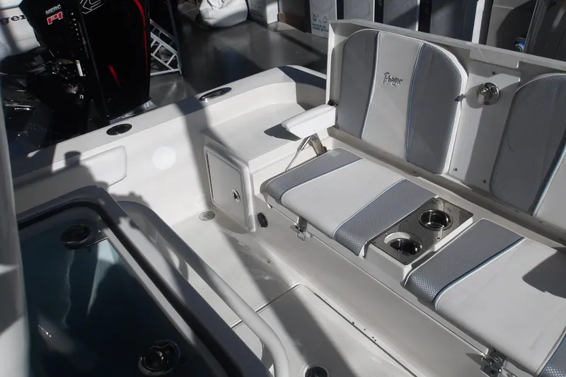 Slide: The Image of 2026 Ranger 2360 Bay boat interior with seating and cup holders. - 29