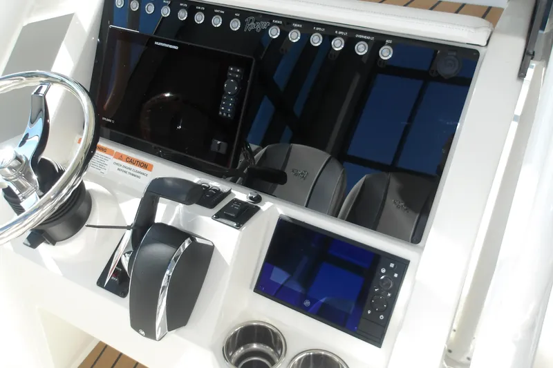 Slide: The Image of 2026 Ranger 2360 Bay boat dashboard with steering wheel, controls, and electronic displays. - 15