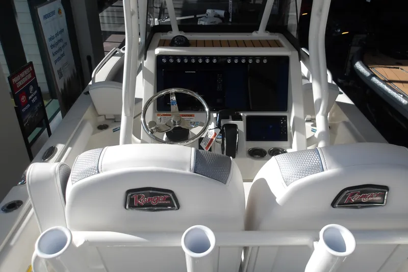 Slide: The Image of 2026 Ranger 2360 Bay boat interior with steering wheel and control panel. - 12