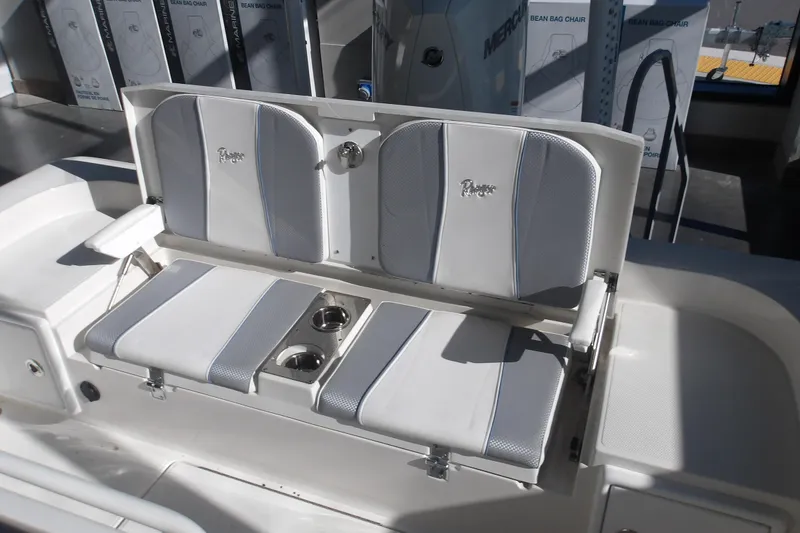 Slide: The Image of 2026 Ranger 2360 Bay boat seating with cup holders and storage compartments. - 28