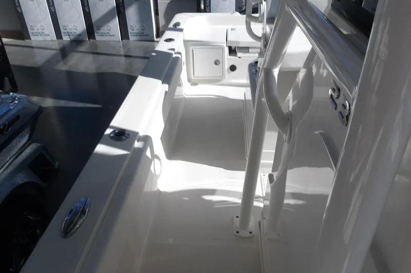 Slide: The Image of Interior view of 2026 Ranger 2360 Bay boat, showcasing sleek design and storage compartments. - 25