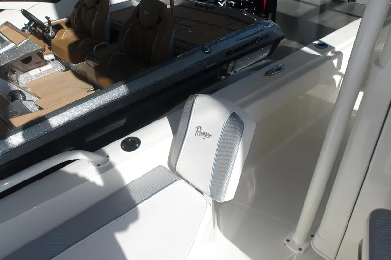 Slide: The Image of 2026 Ranger 2360 Bay boat interior with seating and steering console. - 23