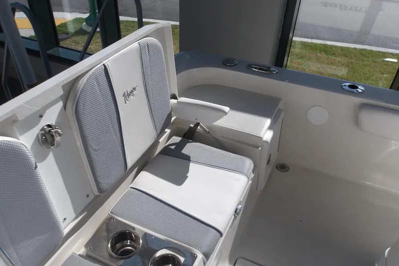 Slide: The Image of Interior seating of 2026 Ranger 2360 Bay boat with cup holders and cushioned seats. - 24