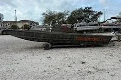 The Image of 2026 Tracker Grizzly 15 Jon boat parked on gravel surface. - 0