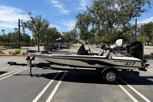 Slide: The Image of 2026 Nitro Z17 boat parked in a sunny lot, showcasing sleek design and modern features. - 3
