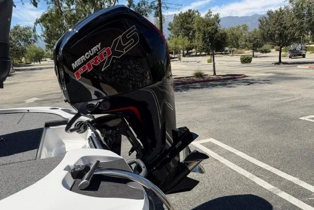 Slide: The Image of Nitro Z17 2026 boat with Mercury Pro XS engine in a parking lot. - 4