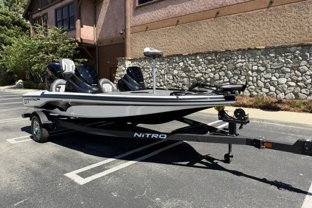 Slide: The Image of 2026 Nitro Z17 boat parked on a trailer in a sunny lot. - 1